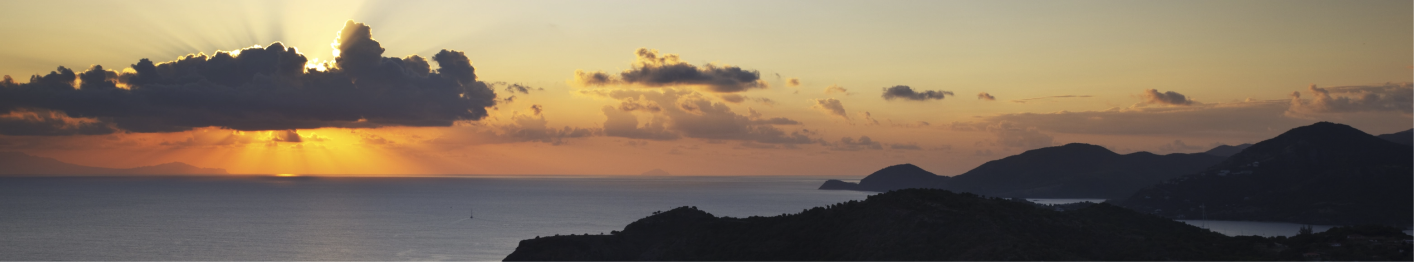 Sunset over the sea and hills of St Barth